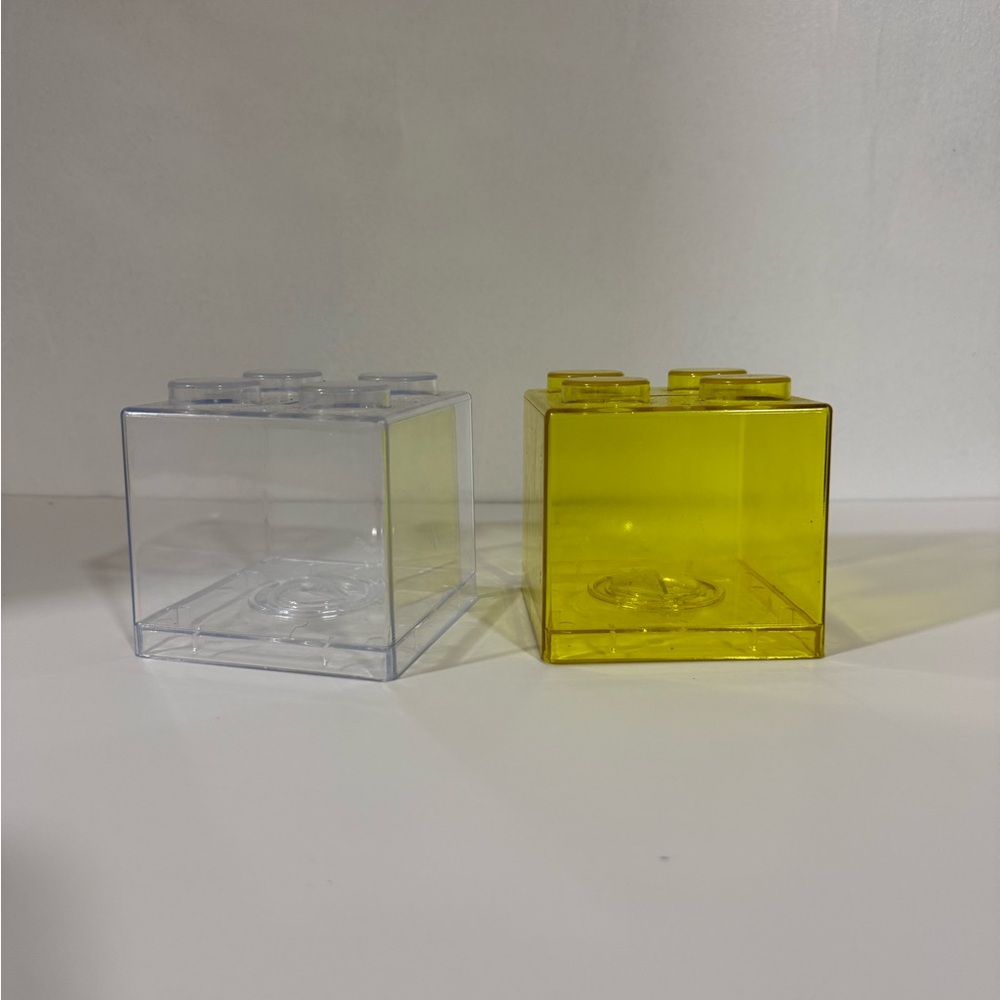 2 transparent Lego Coin banks